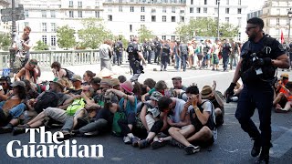 Police use pepper spray on seated climate protesters in Paris [upl. by Derag]